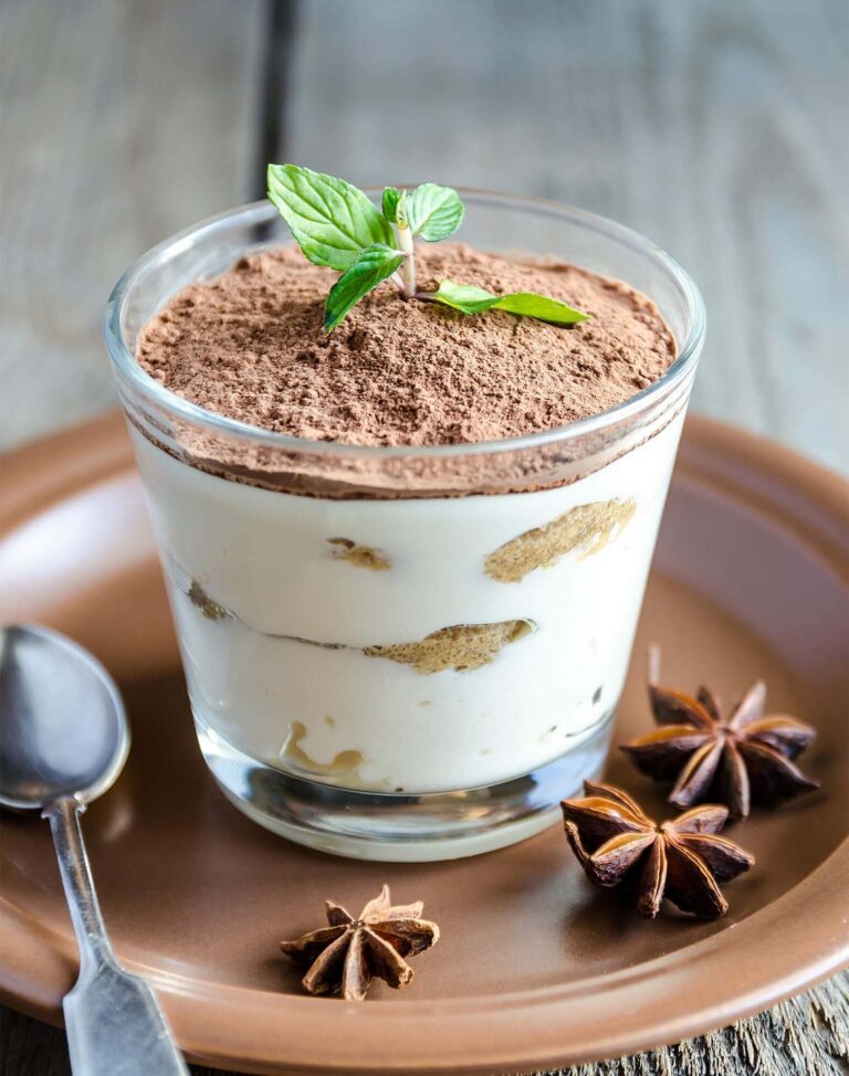 tiramisu-in-the-glass-on-the-wooden-background-2023-11-27-04-49-23-utc-1-e1714544528571.jpg